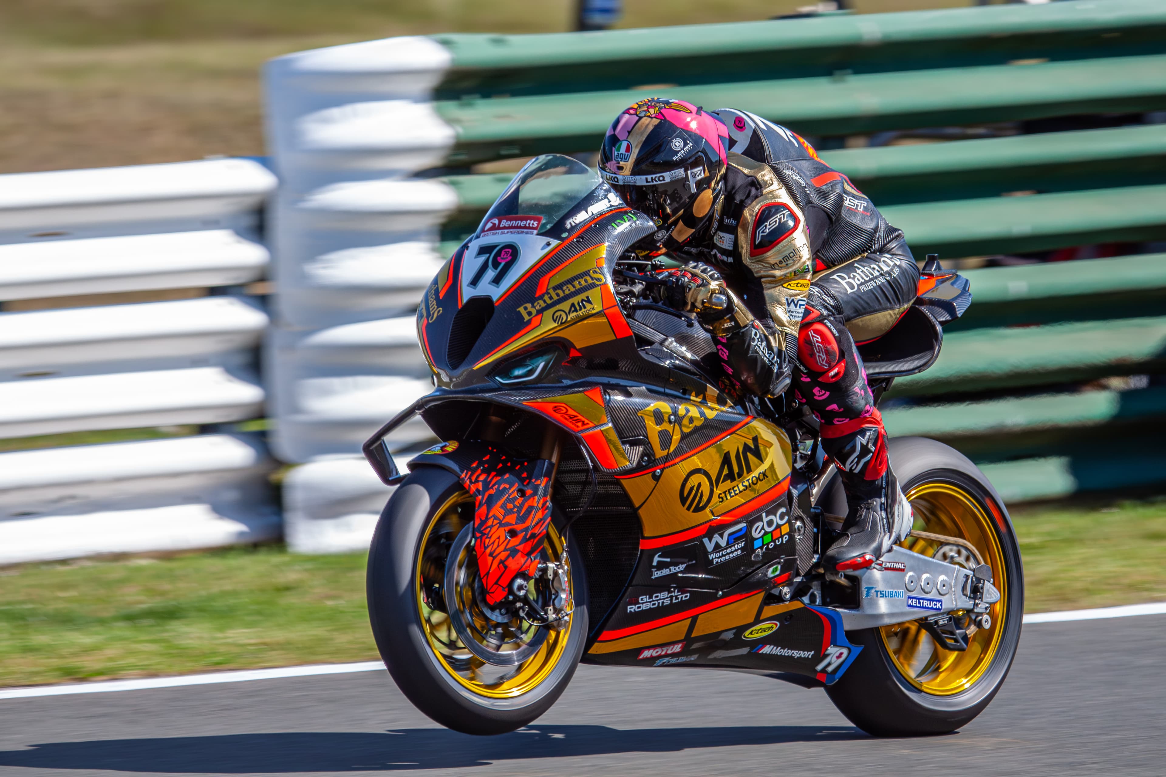 Motorcycle racer leaning through a corner at speed